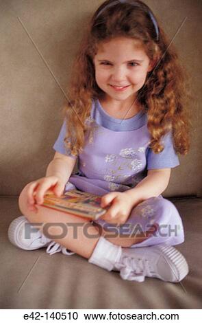 Little girl with book View Large Photo Image Stock Image - Little girl with book. Fotosearch
