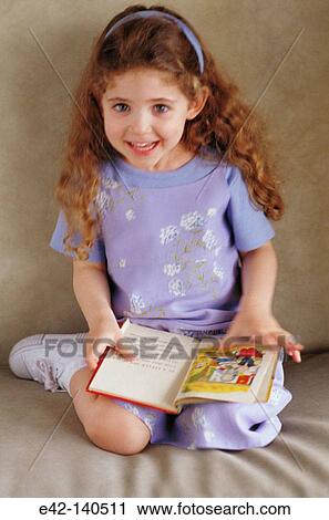 Little girl with book View Large Photo Image Stock Image - Little girl with book. Fotosearch