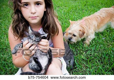 Little girl with kitten and puppy View Large Photo Image Picture - Little girl with kitten and puppy. Fotosearch