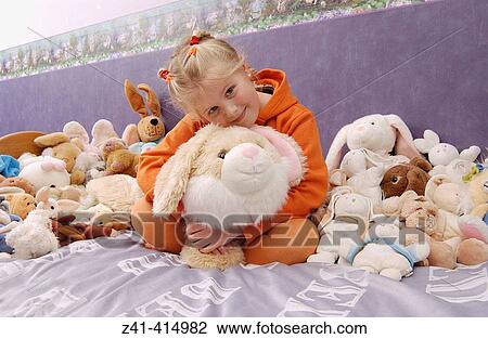 Little girl with many pet-rabbits View Large Photo Image Stock Image - Little girl with many pet-rabbits. Fotosearch