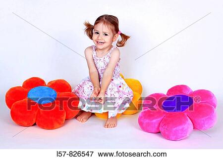 little girl with piggytailes in summer dress sitting on flower shaped pillows, laughing, Studio, Oetwil am See, Switzerland View Large Photo Image Stock Photo - little girl with piggytailes in summer dress sitting on flower shaped pillows, laughing, Studio, Oetwil am See, Switzerland. Fotosearch