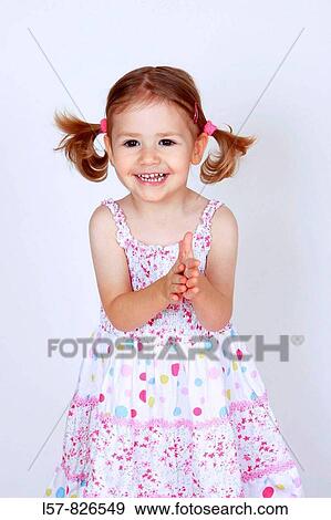 little girl with piggytailes in summer dress, klapping hands, toddler laughing, Studio, Oetwil am See, Switzerland View Large Photo Image Stock Photo - little girl with piggytailes in summer dress, klapping hands, toddler laughing, Studio, Oetwil am See, Switzerland. Fotosearch