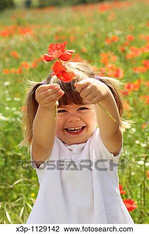 Little girl with poppies View Large Photo Image Stock Image - Little girl with poppies. Fotosearch
