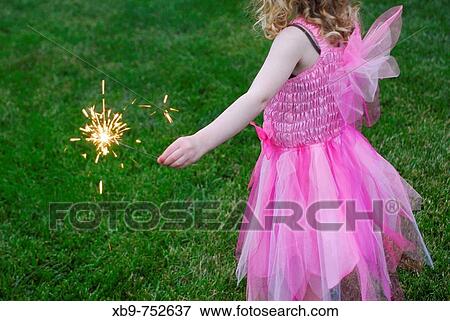 Little girl with sparkler View Large Photo Image Stock Photo - Little girl with sparkler. Fotosearch