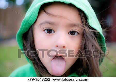 Little Girl With Tongue Sticking Out Stock Image K79 Fotosearch