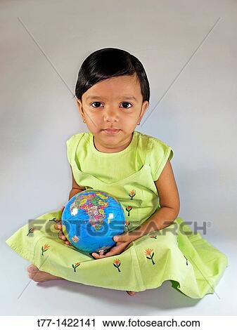 Little girl with world globe View Large Photo Image Stock Image - Little girl with world globe. Fotosearch