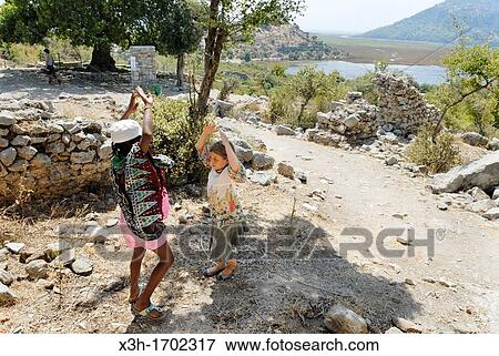 little girls playing at the Caunos archeological site, Dalyan, Turkey, Eurasia View Large Photo Image Stock Photo - little girls playing at the Caunos archeological site, Dalyan, Turkey, Eurasia. Fotosearch
