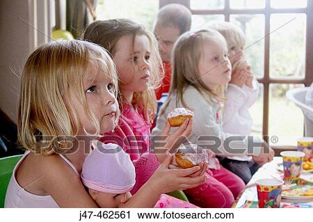 Little girls third birthday party, all the children sitting round the table. View Large Photo Image Stock Image - Little girls third birthday party, all the children sitting round the table.. Fotosearch