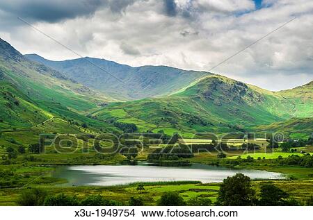 Little Langdale Tarn and Tilberthwaite Fells in the English Lake District, Cumbria, England. View Large Photo Image Picture - Little Langdale Tarn and Tilberthwaite Fells in the English Lake District, Cumbria, England.. Fotosearch