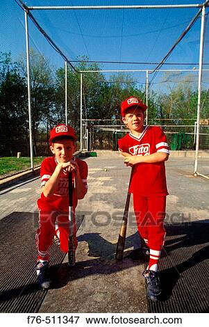 Little league players in batting cage / batting practice. View Large Photo Image Stock Photo - Little league players in batting cage / batting practice.. Fotosearch