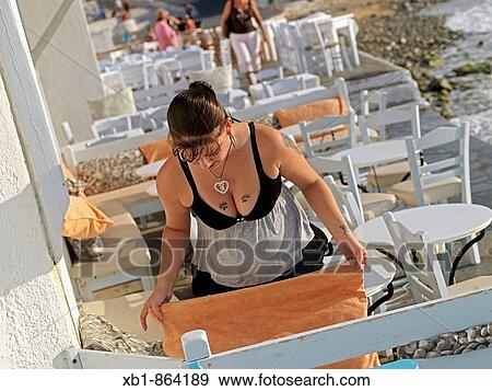 Stock Photo - Little Venice, houses at the seaside of Chora, maintown on the island Mykonos, part of the Cyclades in the Aegean See, Greece. Fotosearch
