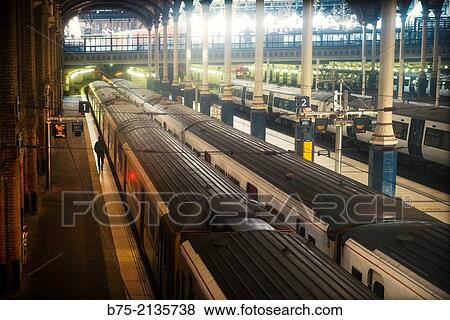 Liverpool Street Train Station with a lonely and unrecognizable man walking on the platform number one, London, England, UK, Europe View Large Photo Image Stock Photo - Liverpool Street Train Station with a lonely and unrecognizable man walking on the platform number one, London, England, UK, Europe. Fotosearch