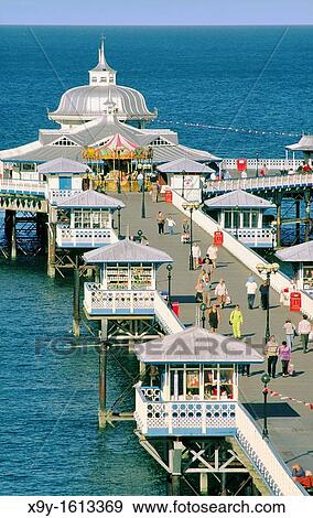 Llandudno Pier Victorian seaside architecture built 1871 on North Beach of holiday resort of Llandudno, Gwynedd, north Wales, UK View Large Photo Image Stock Photo - Llandudno Pier Victorian seaside architecture built 1871 on North Beach of holiday resort of Llandudno, Gwynedd, north Wales, UK. Fotosearch