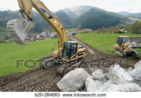 Loading rocks at quarry for construction of breakwater View Large Photo Image Stock Image - Loading rocks at quarry for construction of breakwater. Fotosearch