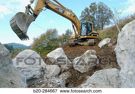 Loading rocks at quarry for construction of breakwater View Large Photo Image Stock Photo - Loading rocks at quarry for construction of breakwater. Fotosearch