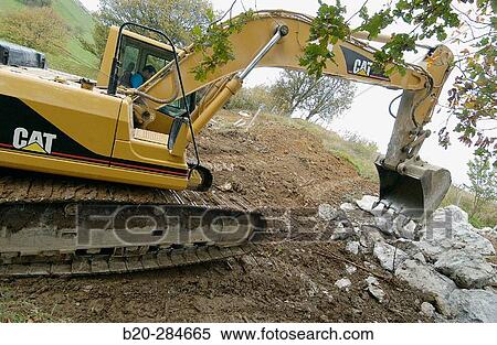 Stock Photography - Loading rocks at quarry for construction of breakwater. Fotosearch
