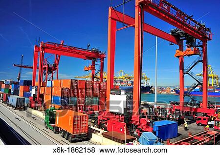 Stock Photo - Loading, unloading and transportation of containers in the port of Barcelona, Barcelona, Catalonia, Spain.. Fotosearch