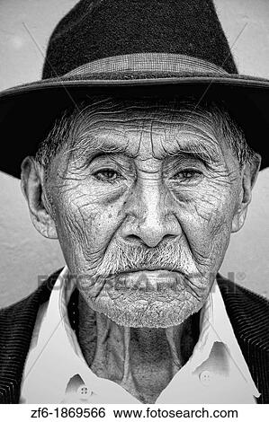 Local black and white image of old man with wrinkles and great eyes against bright wall with black cowboy hat in tourist village of Antigua Guatemala View Large Photo Image Stock Photograph - Local black and white image of old man with wrinkles and great eyes against bright wall with black cowboy hat in tourist village of Antigua Guatemala. Fotosearch