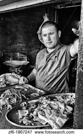 Stock Photo - Local butcher window selling meat and pork in local capital in Havana Cuba. Fotosearch