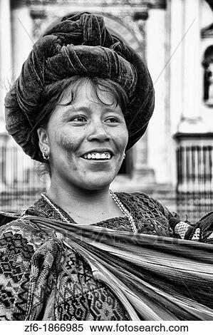 Stock Photography - Local colorful woman portrait with local print dress in tourist village of Antigua Guatemala. Fotosearch