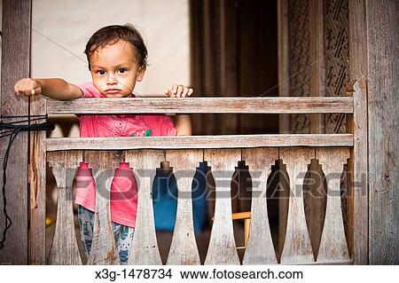 Picture - Local family, half-American half-Indonesian boy, Kuta, Bali, Indonesia. Fotosearch