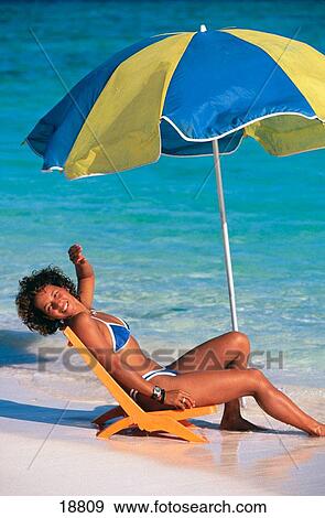 Local girl sitting on the beach, Los Roques Islands, Venezuela View Large Photo Image Stock Photo - Local girl sitting on the beach, Los Roques Islands, Venezuela. Fotosearch