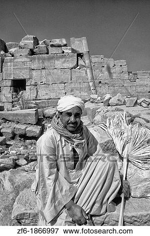 Local guide at the ancient ruins of the Temple of Karnak in Luxor Egypt View Large Photo Image Stock Photo - Local guide at the ancient ruins of the Temple of Karnak in Luxor Egypt. Fotosearch