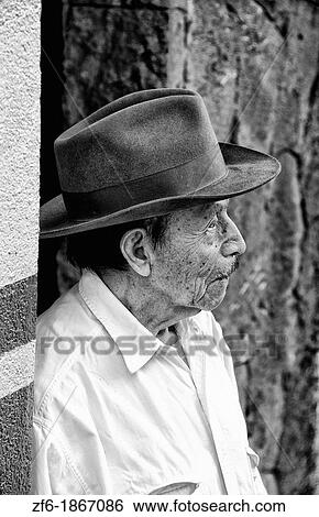 Local humble poor man portrait with cowboy hat in Lake Atitlan village of San Pedro Guatemala in Central America View Large Photo Image Stock Photograph - Local humble poor man portrait with cowboy hat in Lake Atitlan village of San Pedro Guatemala in Central America. Fotosearch