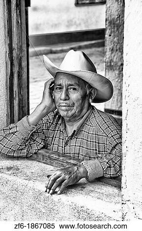 Local humble poor man portrait with cowboy hat in Lake Atitlan village of San Pedro Guatemala in Central America View Large Photo Image Stock Photography - Local humble poor man portrait with cowboy hat in Lake Atitlan village of San Pedro Guatemala in Central America. Fotosearch