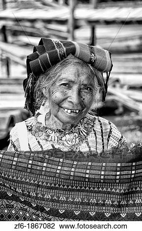 Local humble poor woman portrait with teeth in Lake Atitlan village of San Pedro Guatemala in Central America View Large Photo Image Stock Image - Local humble poor woman portrait with teeth in Lake Atitlan village of San Pedro Guatemala in Central America. Fotosearch