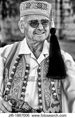 Local man in costume traditional dress in Athens Greece View Large Photo Image Stock Photograph - Local man in costume traditional dress in Athens Greece. Fotosearch