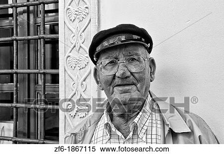Local man in Greek hat in downtown Mykonos Greece in Greek Islands of Europe View Large Photo Image Stock Photography - Local man in Greek hat in downtown Mykonos Greece in Greek Islands of Europe. Fotosearch