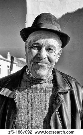 Local man in hat after church in the beautiful Algarve village of Vila de Bispo Portugal View Large Photo Image Stock Image - Local man in hat after church in the beautiful Algarve village of Vila de Bispo Portugal. Fotosearch