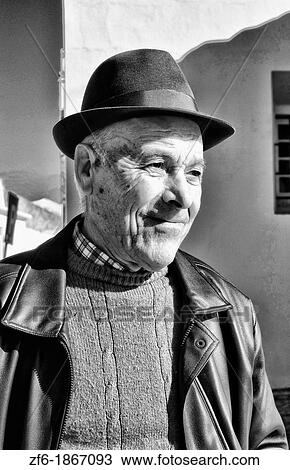 Local man in hat after church in the beautiful Algarve village of Vila de Bispo Portugal View Large Photo Image Stock Image - Local man in hat after church in the beautiful Algarve village of Vila de Bispo Portugal. Fotosearch
