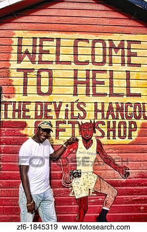 Stock Photo - Local man in the famous town of Hell in the Cayman Islands. Fotosearch