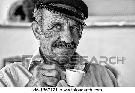 Local man portrait with Greek coffee with Greek hat at restuarant in white in Mykonos in Greek Islands in Greece Europe View Large Photo Image Stock Image - Local man portrait with Greek coffee with Greek hat at restuarant in white in Mykonos in Greek Islands in Greece Europe. Fotosearch