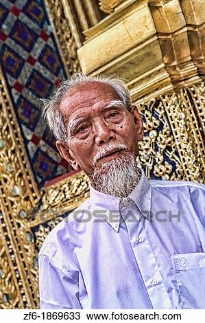 Local man with gold at Emerald Palace in Grand Palace in Bangkok Thailand View Large Photo Image Stock Image - Local man with gold at Emerald Palace in Grand Palace in Bangkok Thailand. Fotosearch