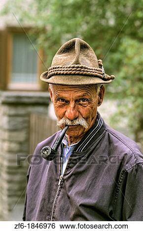 Local man with pipe in St Moritz, Switzerland. View Large Photo Image Stock Photograph - Local man with pipe in St Moritz, Switzerland.. Fotosearch