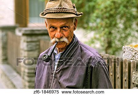 Local man with pipe in St Moritz, Switzerland. View Large Photo Image Stock Photography - Local man with pipe in St Moritz, Switzerland.. Fotosearch