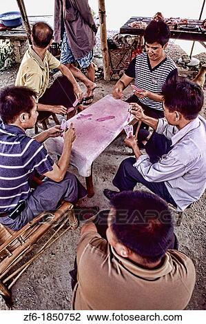 Local men paying Chinese cards in unique Guilin Yangshuo area of China. View Large Photo Image Stock Image - Local men paying Chinese cards in unique Guilin Yangshuo area of China.. Fotosearch