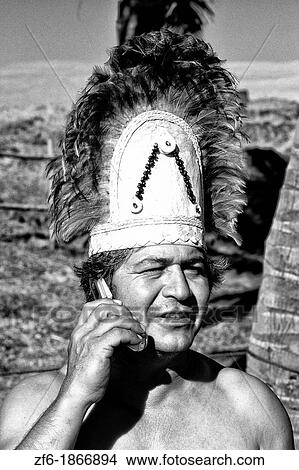 Local native and costume talking on cell phone Easter Island during Tapati Festival Rapa Nui View Large Photo Image Picture - Local native and costume talking on cell phone Easter Island during Tapati Festival Rapa Nui. Fotosearch
