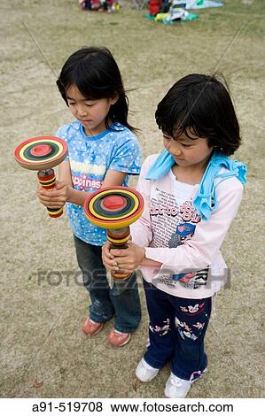 Local traditional skill game called Goma City of Kumamoto Island of Kyushu Japan View Large Photo Image Stock Photo - Local traditional skill game called Goma City of Kumamoto Island of Kyushu Japan. Fotosearch