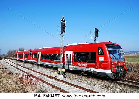Local train of Deutsche Bahn AG to an electrical signal View Large Photo Image Stock Photo - Local train of Deutsche Bahn AG to an electrical signal. Fotosearch