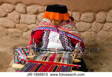 Local woman in the Sacred Valley Peru weaving with yarn in traditional clothes and methods of working View Large Photo Image Stock Image - Local woman in the Sacred Valley Peru weaving with yarn in traditional clothes and methods of working. Fotosearch
