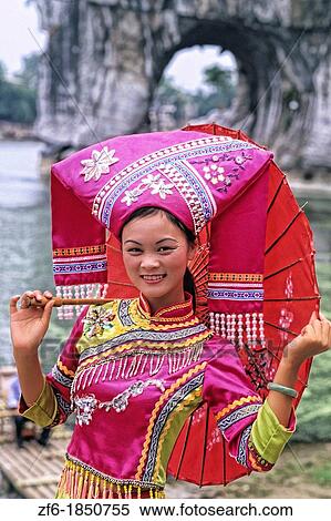 Stock Photography - Local woman in traditional costume portrait of beautiful lady in Guilin area of China.. Fotosearch
