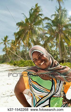 Local woman on beach on Zanzibar Island. View Large Photo Image Stock Photo - Local woman on beach on Zanzibar Island.. Fotosearch