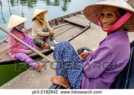 Local Women Wait For Tourists To Take Out On River Boat Trips, Hoi An, Quang Nam Province, Vietnam. View Large Photo Image Stock Image - Local Women Wait For Tourists To Take Out On River Boat Trips, Hoi An, Quang Nam Province, Vietnam.. Fotosearch
