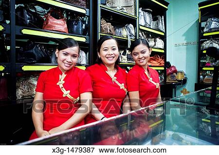 Stock Photo - Local workers at the Cobra Palace. Their job is to prepare the snake blood for customers. Kuta, Bali, Indonesia. Fotosearch