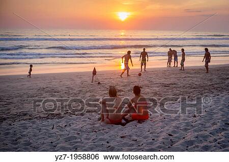 Locals and visitors gather at Santa Teresa beach to watch the sunset, Costa Rica. View Large Photo Image Stock Photograph - Locals and visitors gather at Santa Teresa beach to watch the sunset, Costa Rica.. Fotosearch