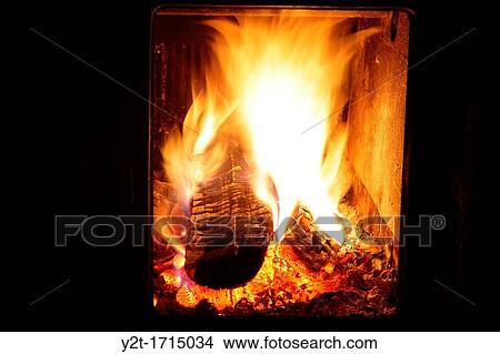 Logs burning in a fireplace View Large Photo Image Picture - Logs burning in a fireplace. Fotosearch